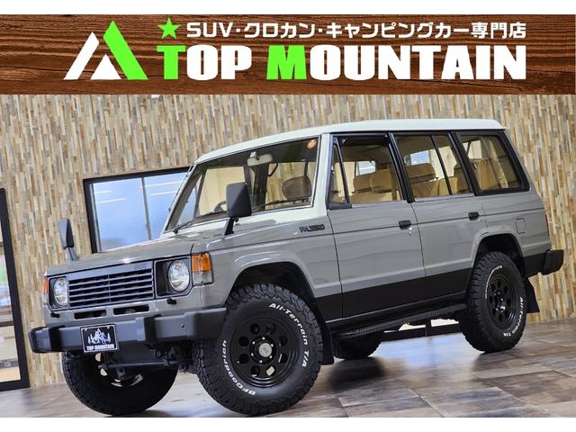 パジェロ ＧＬ　切替４ＷＤ　５ＭＴ　純正丸目レトロ　ディーゼルターボ　グレー×ホワイト全塗装　フェンダーミラー　ジムライン２マットブラック１６インチ　ＢＦＧｏｏｄＲｉｃｈオールテレーン　背面タイヤ　３列シート（1枚目）