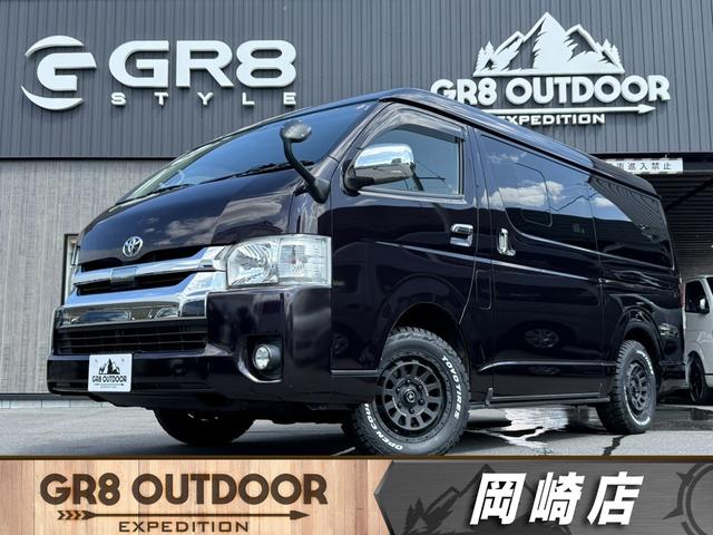ハイエースバン ロングワイドスーパーＧＬ　４ＷＤ／寒冷地仕様／１６インチアルミホイール／バッドフェイスボンネット／フロントエアロ／シートカバー／パナソニックナビ／フルセグＴＶ／両側小窓付きスライドドア／衝突軽減ブレーキ／ＥＴＣ（1枚目）