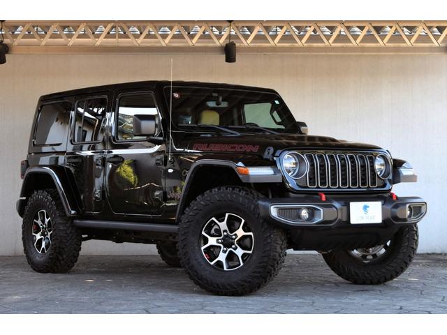 ジープ・ラングラーアンリミテッド(ジープ) ルビコン　４ＷＤ　ＭＴ　新車並行車　ベージュレザーシート　カラールーフＴＯＰ　同色フェンダー　８．４インチモニター　カープレイ　リフトアップ　ジオランダー３５外形ＭＴタイヤ　２０２４グリル 中古車画像