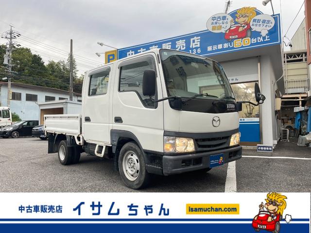 タイタンダッシュ WキャブワイドローDX 5MT 6人乗り 荷台鉄板張り 平ボディ 低床 後輪ダブルタイヤ 最大積載量1250kg 荷台サイズ 長さ210cm 幅160cm 高さ37cm 前席パワーウィンドウ エアコン フロントフォグライト(1枚目)