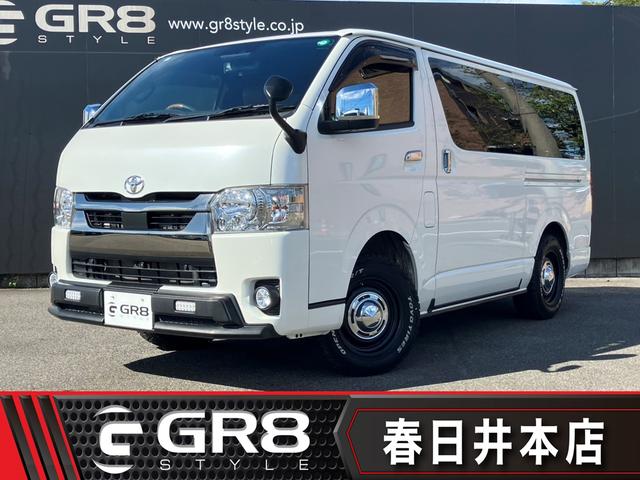ハイエースバン スーパーＧＬ　ダークプライムＩＩ　４ＷＤ／寒冷地仕様／ナビＴＶ／バックカメラ／ＥＴＣ／パノラミックビューモニター／デジタルインナーミラー／フロントスポイラー／１６ｉｎアルミ／シートカバー／ＬＥＤヘッドライト／床張りキット／ベッドキット（1枚目）
