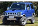 ジムニー ＦＩＳフリースタイルワールドカップリミテッド　４ＷＤ　リフトアップ　社外マフラー　前後ショートバンパー　ナビ　ＥＴＣ　Ｍ／Ｔタイヤ（1枚目）