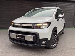 フリード e:HEVクロスター 当店展示車 新車未登録 ブラックエンブレム ボディーサイドモール べルリナブラックフロントグリル マルチビューカメラ アダプティブドライビングビーム 後退出庫サポート付き 専用15インチアルミホイール 中古車画像