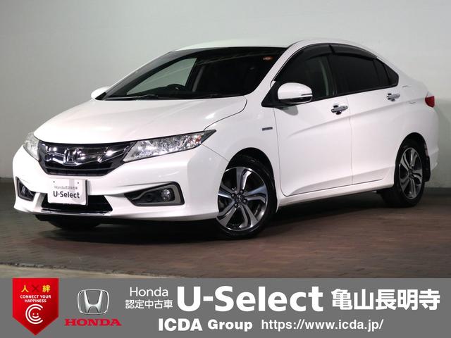 グレイス(ホンダ) ハイブリッドＥＸ　ＥＴＣ　ナビ装着パッケージ　安心パッケージ　クルーズＣ　シートヒーター　ＬＥＤオートライト　ハーフレザーシート　インテリキー　プッシュスタート　Ａストップ　純正１６インチアルミ　スペアキー 中古車画像