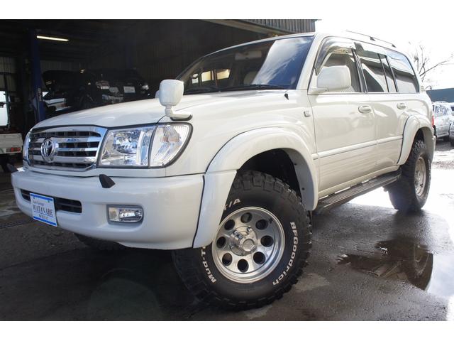 トヨタ ランドクルーザー１００ｖｘリミテッド ディーゼルターボ ４ｗｄ リフトアップ ディーゼルターボ ｈｄｄナビ ミッキーアルミ ｂｆマッドタイヤ エンジンスターター ルーフレールリアスポイラー バックモニター 背面レス 下回り錆止め施工の中古車 1998年式 走行