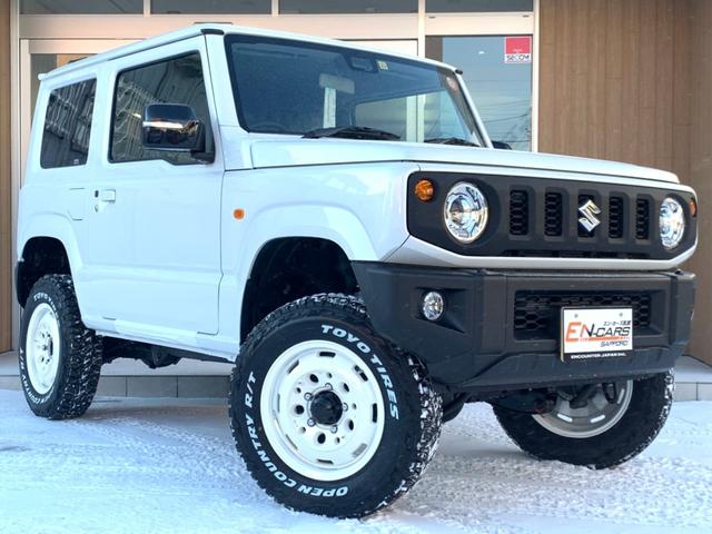 ジムニー スズキ ｘｃ ｅｎ リフトアップカスタム 届出済未使用車 ３インチリフトアップ 下回りノックスドール防錆施工 ｔｏｙｏオープンカントリーｒｔ １８５ ８５ｒ１６新品装着 ガルシアシスコ１６インチａｗホワイト新品装着 北海道 ｘｃ ｅｎ リフト