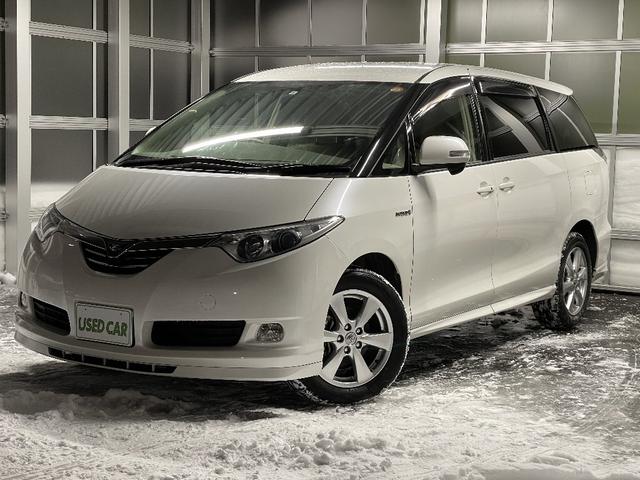 トヨタ エスティマハイブリッドｘ ４ｗｄ 夏冬タイヤ付き プッシュスタート 純正ナビ ｔｖフルセグ バックカメラ 後席モニター ワンオーナー ｈｉｄライト フオグ ｅｔｃ ｄｖｄビデオ スマートキーの中古車 08 平成 年式 走行7 1万キロ 車体色パール 北海道札幌市北
