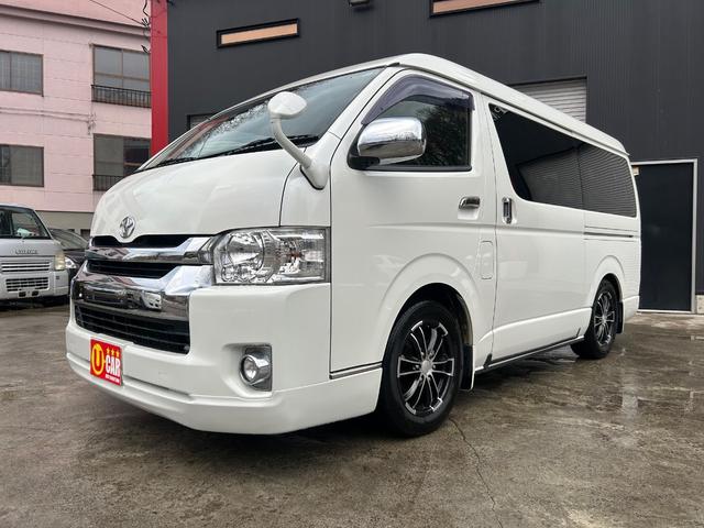 ハイエースワゴン(トヨタ) ＧＬ　ファインテックツアラー　４ＷＤ　両側パワースライドドア　Aftermarketナビ　ＴＶ　Ｂカメラ　フリップダウンモニター　フロントスポイラー　AftermarketＬＥＤテールランプ　シートカバー 中古車画像