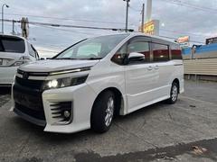 ヴォクシー ZS ナビ TV 両側スライド・片側電動 スマートキー アイドリングストップ 電動格納ミラー 3列シート CVT アルミホイール ESC エアコン パワーウィンドウ 中古車画像