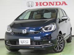 フィット e:HEVリュクス 自社レンタカー 純正9インチナビ 夏冬タイヤ付 TVフル リアカメラ ETC 4WD アルミホイール シートヒーター オートクルーズコントロール DVD再生 アイドリングストップ 衝突防止システム 中古車画像