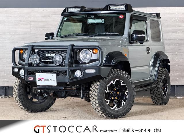 ＪＣ　リフトアップ　純正８型ナビ／フルセグ／ＤＶＤ／Ｂｌｕｅｔｏｏｔｈ　ＥＴＣ２．０　バックカメラ　トラストマフラー／エアクリ　外Ｆバンパー／グリルガード／オバフェン　外１６ＡＷ　マッドタイヤ　カスタム