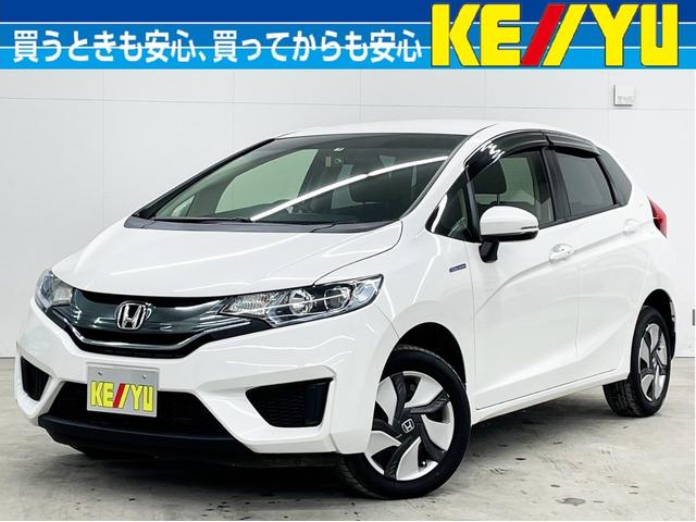 フィットハイブリッド(ホンダ) Ｆパッケージ　４ＷＤ　寒冷地仕様　社外メモリーナビ　ＣＤ　ＤＶＤ再生　フルセグＴＶ 中古車画像