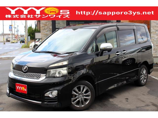 ヴォクシー ZS 煌 ユーザー買取直販・後席モニター・フルセグテレビ・両側パワースライドドア・ガイドライン付きバックカメラ・ETC・エンジンスターター・リヤオートエアコン・プッシュスタートBluetoothオーディオ(1枚目)