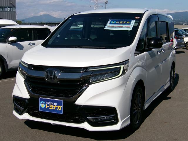 ステップワゴン(ホンダ) e:HEVモデューロX ホンダセンシング 雹災車 10インチナビ TV DVD再生 マルチビューカメラ 後席モニター 両席シートヒーター ハーフレザーシート CMBS 両側電動スライドドア BLuetooth接続 ドラレコ ETC2.0 中古車画像