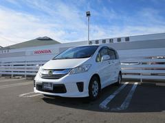 フリード Gジャストセレクション ナビ装着用スペシャルパッケージ2列目外側アームレスト(6人乗り)ジャストセレクション装備リア右側パワースライドドアHondaスマートキーシステム+イモビライザー 両側Pスライドドア Bモニター Dレコ 中古車画像