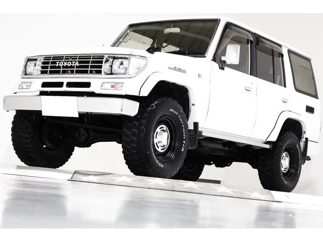 ランドクルーザープラド(トヨタ) ＳＸワイド　４ＷＤ　タイベル交換済　リフトアップ　ヴィンテージ１６インチアルミホイール　ブラックレザー調シートカバー　ウッドステアリング 中古車画像