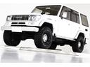 ＳＸワイド　４ＷＤ　タイベル交換済　リフトアップ　ヴィンテージ１６インチアルミホイール　ブラックレザー調シートカバー　ウッドステアリング　７０仕様クロームメッキフロントバンパー　オールクロームメッキグリル(1枚目)