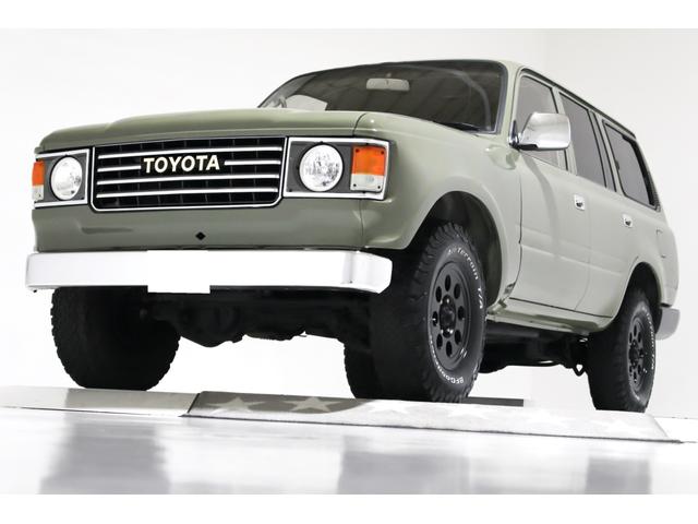 ランドクルーザー８０ ＶＸリミテッド　４ＷＤ　　６０仕様　丸目フェイス　レザー調シートカバー　ジムライン１６インチＡＷ　ＢＦＧｏｏｄｒｉｃｈ　オールテレーンタイヤ　社外ウッド調ステアリンク　ナビ　ＴＶ　ＥＴＣ　ＡＢＳ　電動格納ミラー（1枚目）