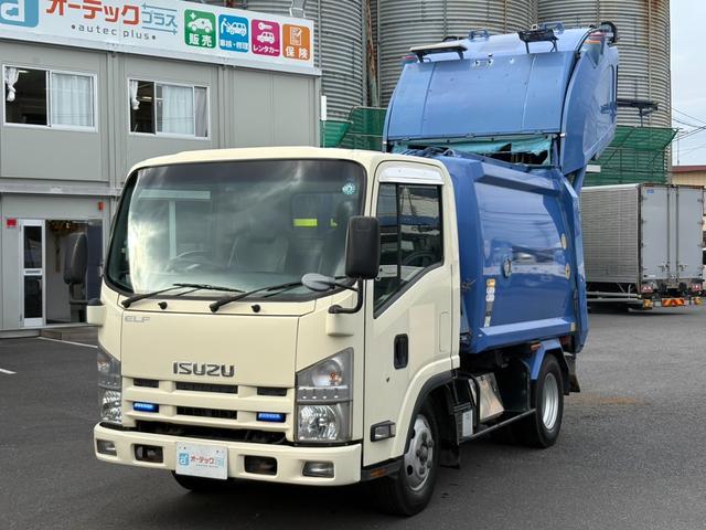 エルフトラック パッカー車　４．２立米　極東開発製プレス式パッカー　最大積載量２０００ｋｇ　左スライドドア　汚水タンク　ＬＥＤ電光掲示板　６速マニュアル（1枚目）