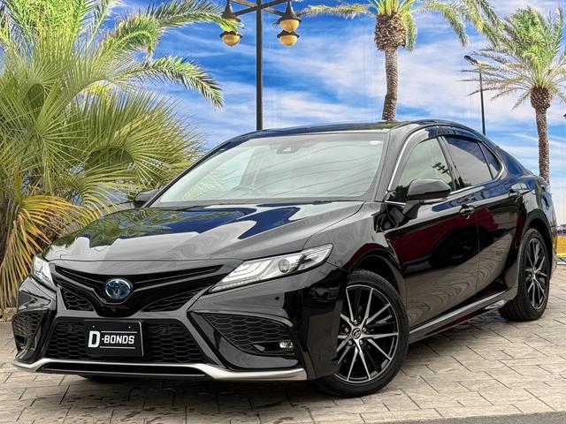 カムリ(トヨタ) WSレザーパッケージ 後期型・パノラミックビューモニター・TRDマフラー/トランクスポイラー・9インチディスプレイ・TV・TVキャンセラー・HDMI入力端子・前後ドラレコ・新車保証令和10年6月まで有り・1オーナー・禁煙車 中古車画像