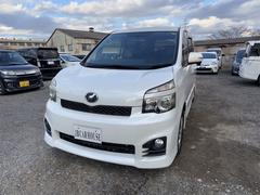 ヴォクシー ZS ETC バックカメラ ナビ TV 片側電動スライドドア HID スマートキー 電動格納ミラー 後席モニター 3列シート フルフラット ウォークスルー CVT アルミホイール CD DVD再生 中古車画像