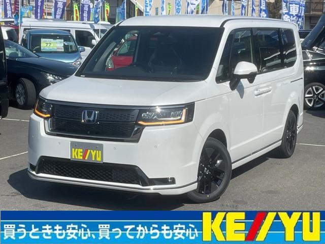 ホンダ ステップワゴン ｅ：ＨＥＶスパーダ衝突軽減【登録済未使用車／７人乗】　【走行５Ｋｍ】【１１．４型ＳＤナビ●１５．６型フリップダウンＭ●マルチビュー全方位カメラ●２．０ＥＴＣ】●電動Ｒゲート／両側自動ドア●ヒーター付ハーフレザーシート●ＢＳＭ／レーダークルーズ／Ｉストップ