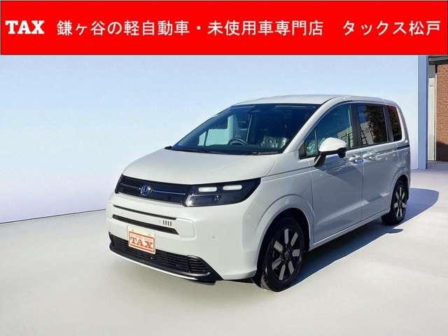 フリード ｅ：ＨＥＶエアー　ＥＸ　登録済み未使用車　メーカー保証継承　ホンダセンシング　ブラインドスポットインフォメーション　１５インチＡＷ　シートヒーター　リアクーラー（1枚目）