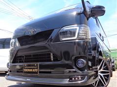 トヨタ　レジアスエースバン　スーパーＧＬ　ダークプライム　４型６ＡＴフルエアロ１オーナーナビＴＶ後席ＴＶＳ　ＢカメラＥＴＣＤレコＥＧスターター電動ドアスマートキープロジェクターＬＥＤ２０ＡＷレザー黒木目ハンドルスイッチリアフィルムリアシートベルトＡＣ１００Ｖ