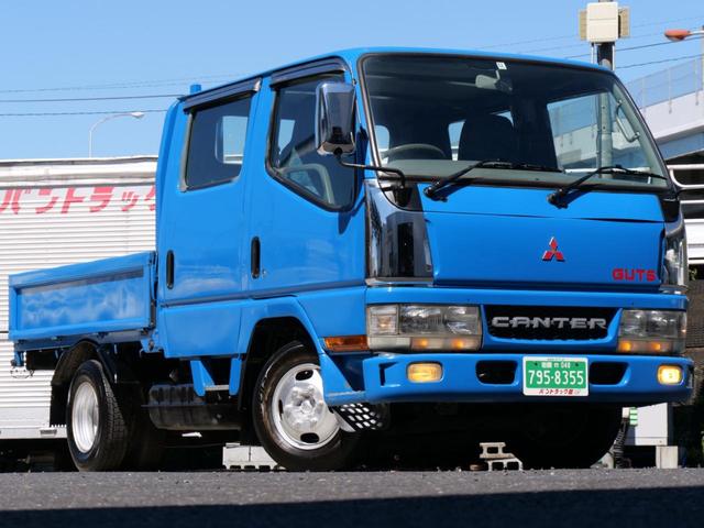 三菱ふそう キャンターガッツ 　積載１．２５トン　Ｗキャブ　６人乗　ＮＯＸＰＭ法適合車ガソリン　普通免許　５速ＭＴ　三方開　角付き鳥居　荷台鉄板床貼り　全低床　タイミングベルト交換済　Ｍ＋Ｓタイヤ　メッキパーツ　４ナンバー　小型貨物