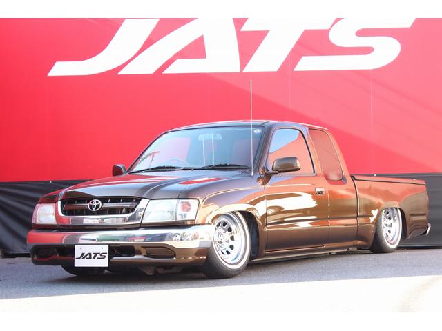 ハイラックススポーツピック(トヨタ) エクストラキャブ　ジャッツエアサス装着　Ｃノッチ加工　デイトナクロームホイール　ホワイトリボンタイヤ　トノカバー　Aftermarketウッドステアリング　シートカバー　Aftermarketナビ　ＥＴＣ 中古車画像