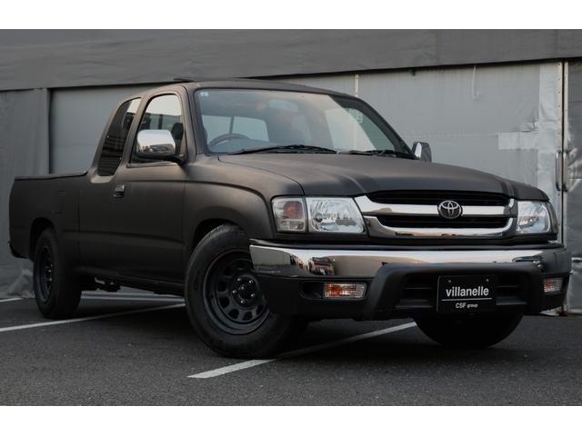 ハイラックススポーツピック(トヨタ) エクストラキャブ　ローダウン　純正サンルーフ　タコマバンパー　ハードトノカバー　ブラックデイトナホイール　Ｗアームグリル　シートカバー　カップホルダー　ドアトリム張り替え　キーレス　Aftermarket１ＤＩＮデッキオーディオ　ＥＴＣ 中古車画像