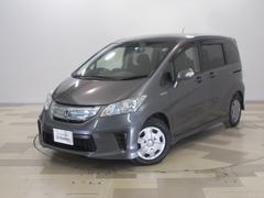 フリードハイブリッド　ジャストセレクション　禁煙車ワンオーナー　ナビ　リアカメラ　片側電動スライドドア　ＨＩＤヘッドライト　両側スライド片側電動ドア　横滑り防止機能　ＵＳＢ接続　記録簿　オートクルーズ　エアバック　ウォークスルー　ＤＶＤ再生可能（ホンダ）