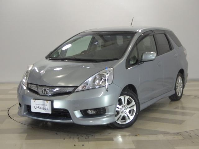 フィットシャトルハイブリッド(ホンダ) ハイブリッド・ナビプレミアムセレクション 禁煙 ワンオーナー HDDナビ リアカメラ スマートキー HID クルーズコントロール ミュージックラック DVD再生 リモコンポール ドアバイザー ECON Bカメラ セキュリティーアラーム ETC 中古車画像