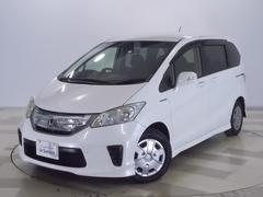フリードハイブリッド ジャストセレクション 禁煙車 2列目ベンチシート(7人乗り) ディスチャージヘッドライト 両側PSD スマートキー クルーズコントロール ディスプレーオーディオ リアカメラ ドラレコ セキュリティー 横滑り防止機能 記録簿 中古車画像