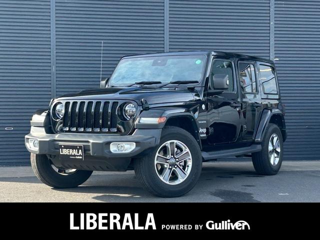 ジープ・ラングラーアンリミテッド(ジープ) サハラ　ワンオーナー　衝突軽減Ｂ　ＡＣＣ　ＢＳＭ　Ｂ／Ｓカメラ　パークセンサー　黒革　Ｓヒーター　ステアヒーター　ナビ　ＴＶ　ＣａｒＰｌａｙ　ＡＬＰＩＮＥスピーカー　ＬＥＤ　ＥＴＣ　純正１８ｉｎＡＷ　禁煙車 中古車画像