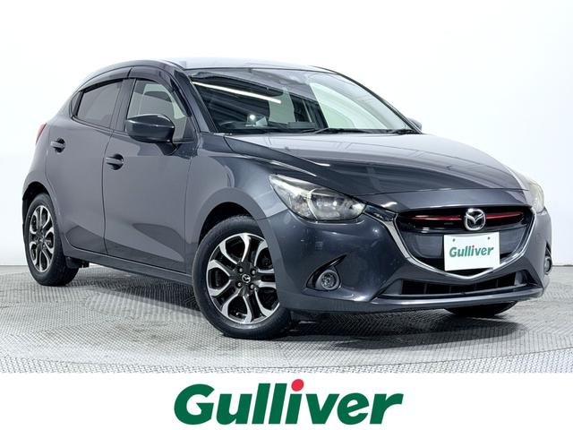 デミオ(マツダ) ＸＤツーリング　純正ナビＴＶ　バックカメラ　クルーズコントロール　衝突軽減ブレーキ　レーンアシスト　ブラインドＳＭ　ヘッドアップディスプレイ　スマートキー　プッシュスタート　アイドリングストップ　オートライト　ＥＴＣ 中古車画像