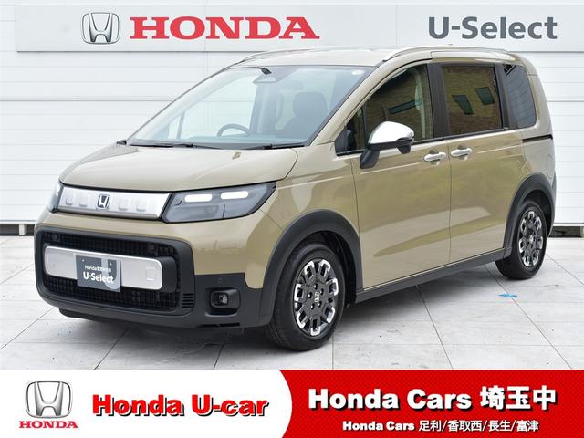 フリード ｅ：ＨＥＶクロスター　登録済未使用車　ＨｏｎｄａＳＥＮＳＩＮＧ　両側自動ドア　リアクーラー　ＬＥＤライト　オートエアコン　オートクルーズコントロール　盗難防止システム　キーレス　スマキー　Ｓヒーター（1枚目）