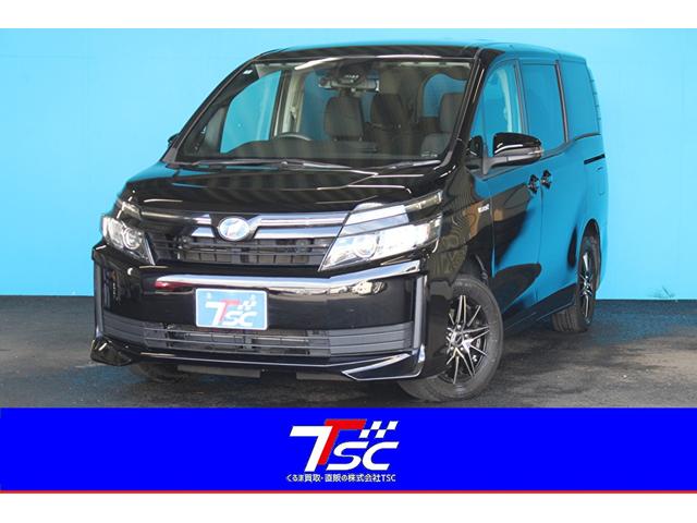 ヴォクシー ハイブリッドＸ　禁煙車／セーフティセンス／７人乗り／後席モニター／純正１０インチナビ／バックカメラ／フルセグ／両側パワースライドドア／ＬＥＤヘッドライト／プッシュスタート／ＥＴＣ／デジタルインナーミラー型ドラレコ（1枚目）