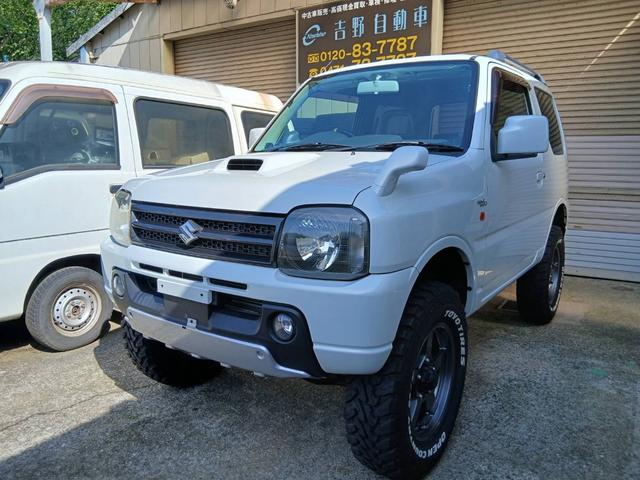 ワイルドウインド　４ＷＤ　５速ＭＴ　社外１６インチアルミホイール　社外マフラー　社外足回り　リフトアップ　社外オーディオ　社外フルセグ地デジチューナー　社外パーツ