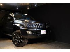 ランドクルーザープラド TZ TZ 8人乗り マットカラーカスタム 社外ヘッドライト・リアテール 17インチホイール・オールテレーンタイヤ クルーズコントロール 純正ナビ ルーフレール ETC 中古車画像