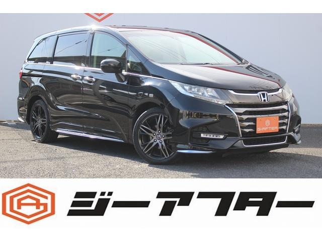 オデッセイ(ホンダ) アブソルート・ホンダセンシング　後席モニタ−／ハーフレザー／純正ナビ／バックカメラ／地デジ／両側電動 中古車画像