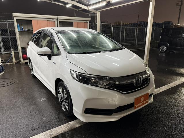 シャトル(ホンダ) ハイブリッド ホンダセンシング 禁煙車 純正ナビ フルセグTV バックカメラ 衝突軽減 レーダークルーズコントロール ETC 電動格納ミラー プッシュスタート 路外逸脱抑制システム LEDヘッドライト Bluetooth接続 中古車画像