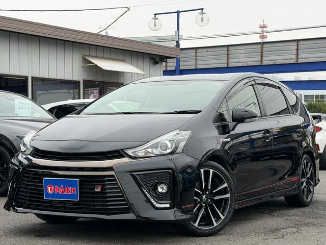 プリウスα（トヨタ）Ｓツーリングセレクション・ＧＲスポーツ　９ｉｎフルセグナビ・Ｂカメラ・ＢＴオーディオ・ＤＶＤ再生・ＬＥＤライト・１８ＡＷ・ハーフレザー・ドアバイザー・プライバシーガラス・本革ステア・ミラーウィンカー・スマキー・記録簿 中古車画像