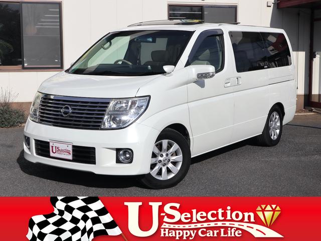 エルグランド(日産) ３５０ＸＬ　４ＷＤ　３列シート　７人乗り　両側電動スライドドア　Ｗサンルーフ　純正ナビ　ＣＤ／ＭＤ／ＤＶＤ／ＴＶ再生　バックカメラ　後席モニター　ＥＴＣ　スマートキー　ヒーター付ベージュ革シート　電動リアカーテン 中古車画像
