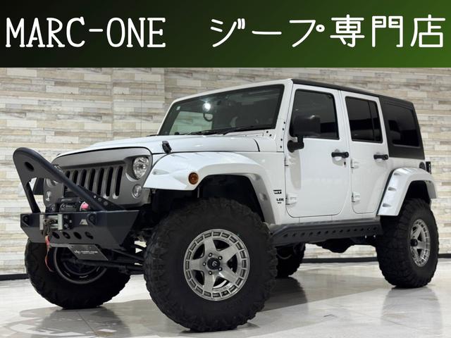 ジープ・ラングラーアンリミテッド スポーツ 1年保証付/正規ディーラー車/シートカバー/Carrozzeriaナビ/フルセグ/BT/CD&DVD/ETC/クルコン/S&Bカメラ/リフトアップ/オーバーフェンダー/XRCウィンチ/社外17AW(1枚目)