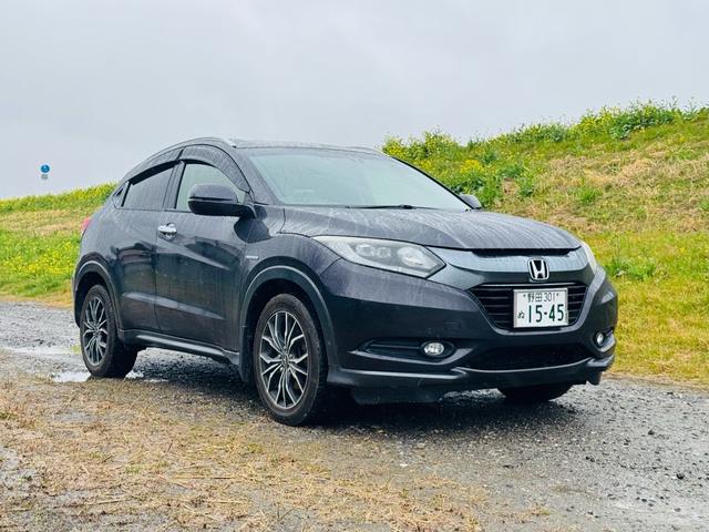 ヴェゼル(ホンダ) ハイブリッドＸ・Ｌパッケージ　フルタイム４ＷＤ　ＢＴオーディオ　ＨＤＤナビ　ＥＣＯＮ　リアカメラ　黒革シート 中古車画像