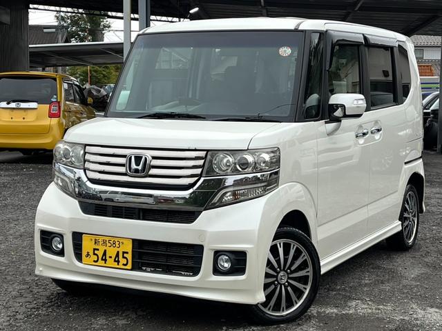 Ｎ－ＢＯＸカスタム Ｇ・ターボパッケージ　４ＷＤ　バックカメラ　両側電動スライドドア　ナビ　ＴＶ　オートクルーズコントロール　ＨＩＤ　スマートキー　アイドリングストップ　ベンチシート　ＣＶＴ　盗難防止システム　ＡＢＳ　ＥＳＣ　ＣＤ　ＵＳＢ（1枚目）