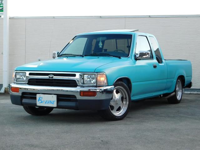 ハイラックス(トヨタ) エクストラキャブ　左ハンドル　２ＷＤ　Ｖ６　３０００ｃｃ　純正サンルーフ　フロアＡＴ　ＢＯＹＤＳ１６インチ　サイド出しマフラー　サーフバンパー　Aftermarketステアリング 中古車画像