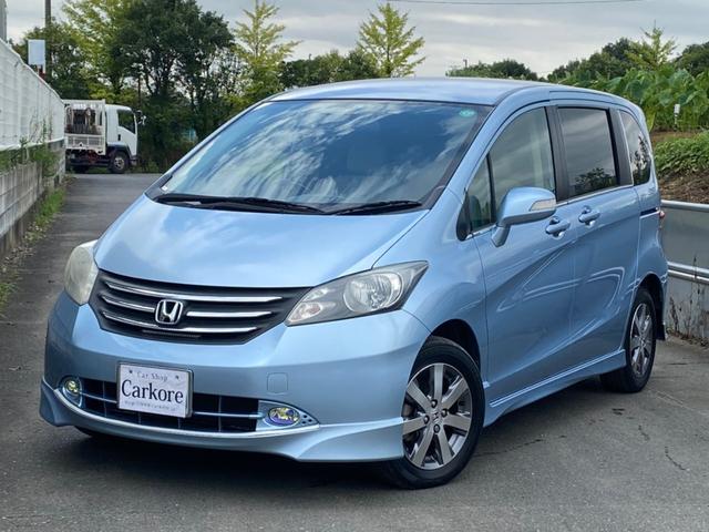 ホンダ フリードｇ エアロ ｌパッケージ 左電動スライドドア ナビ ブルートゥース接続 ｅｔｃ ｃｄ ｄｖｄ再生 キーレス ｈｉｄ クリアランスソナー 純正１５インチアルミホイール 純正エアロ ７人乗り タイミングチェーンの中古車 車体価格23万円 09 平成21 年式 走行