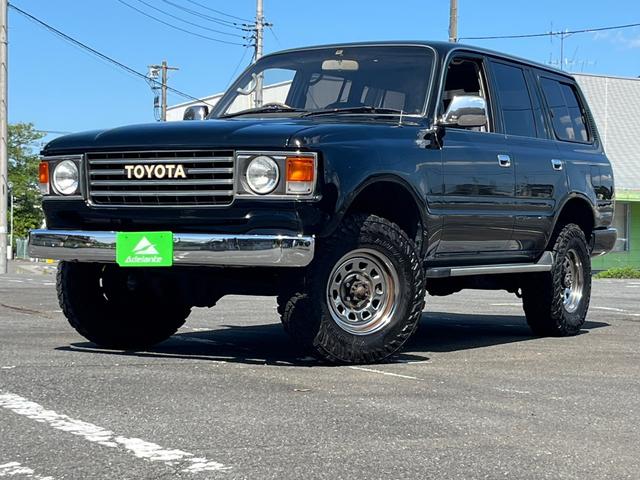 トヨタ ランドクルーザー８０ ＶＸ　６０丸目フェイス・リフトアップ・ＴＯＹＯＴＡグリル・メッキバンパー・木製ハンドル・エクリプスナビ・地デジＴＶ・シートカバー・ＭＡＤタイヤ・サンルーフ・ＥＴＣ・リアクーラー